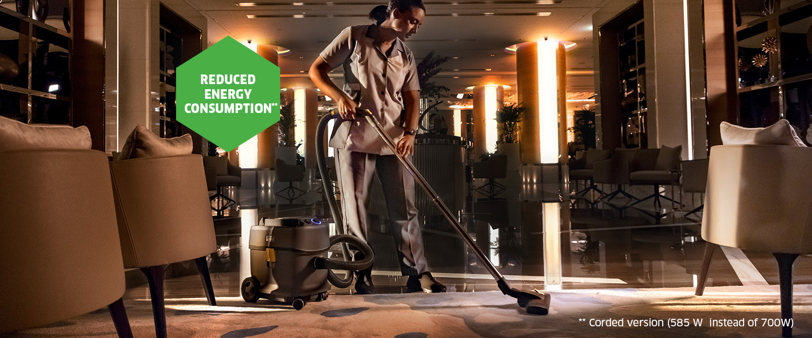 Hotel carpet being cleaned with a dry vacuum cleaner Hotel carpet being cleaned with a dry vacuum cleaner