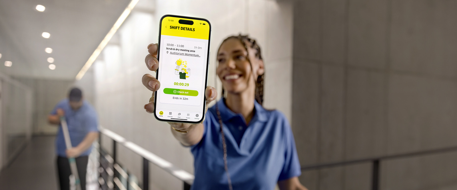 Connected Cleaning helps managers keep an overview over their team's work Smiling cleaning manager working in Connected Cleaning