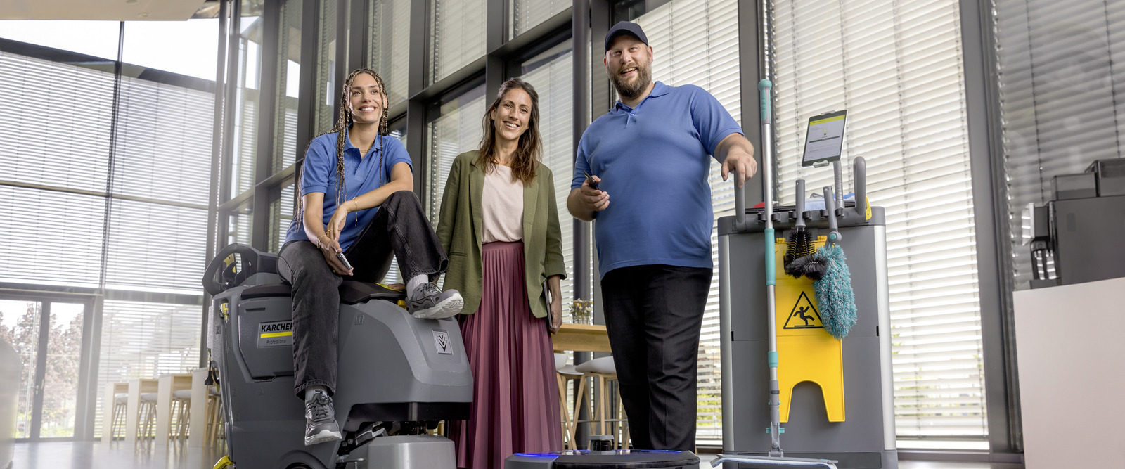 Cleaning team group photo: Using Connected Cleaning on tablet and phone