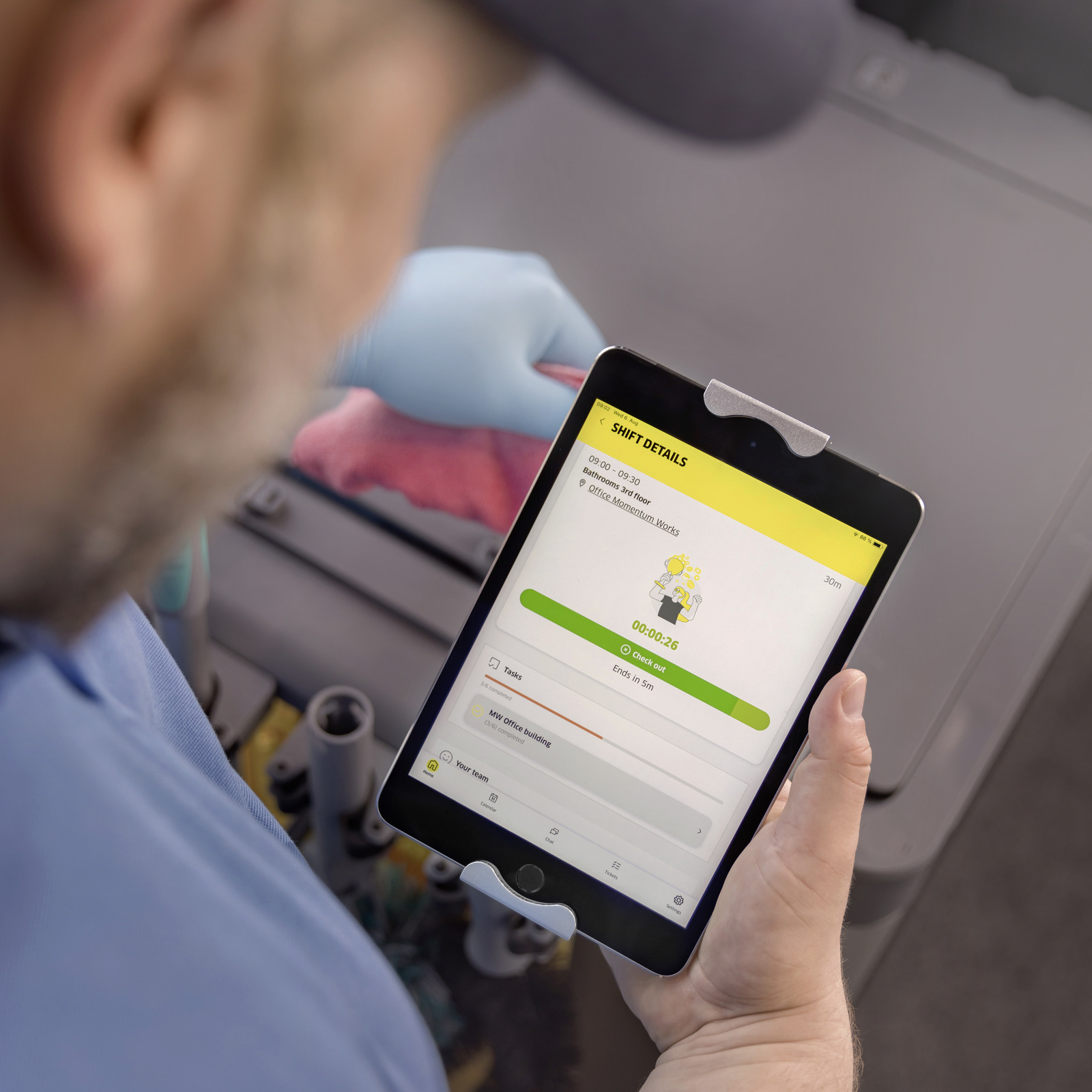 Cleaning professional checks into his shift on the Connected Cleaning mobile app