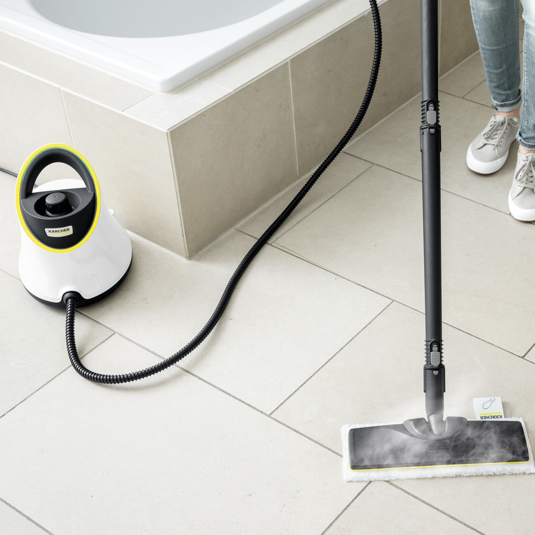 Woman cleaning bathroom using Kärcher steam cleaner SC 2 Deluxe EasyFix