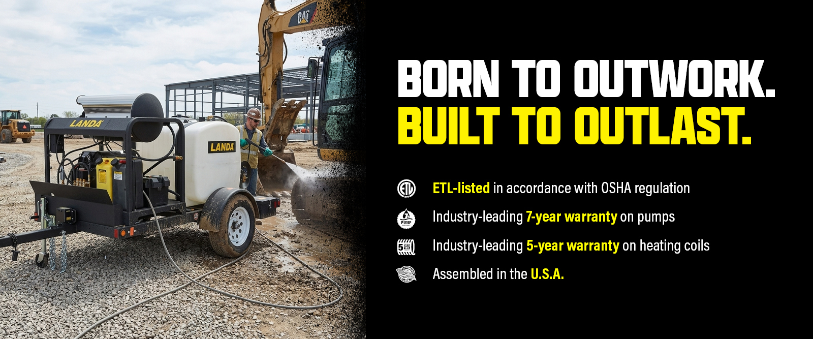 A worker pressure washes construction equipment with a Landa hot water pressure washer