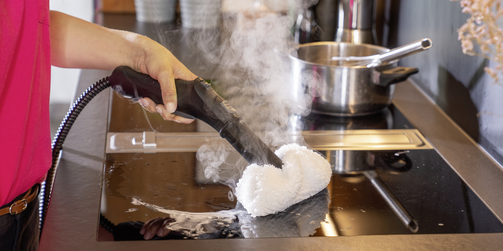 Person cleaning floor using Kärcher steam cleaner