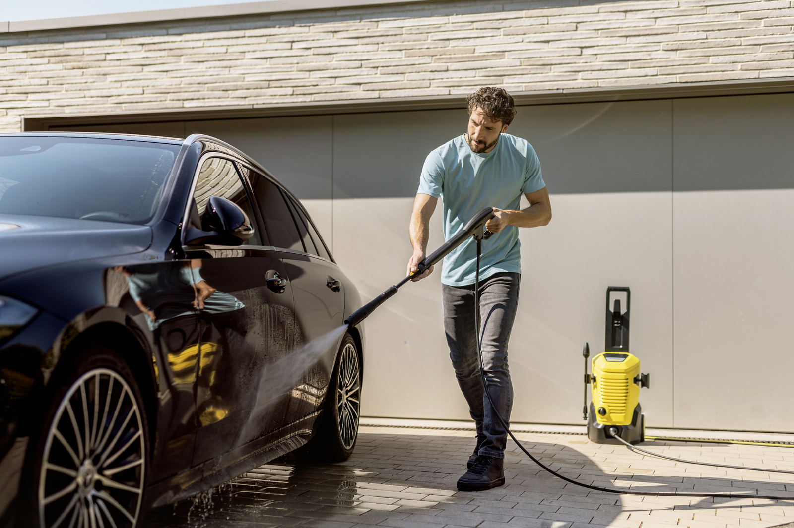 Person cleaning floor with Power Control trigger gun
