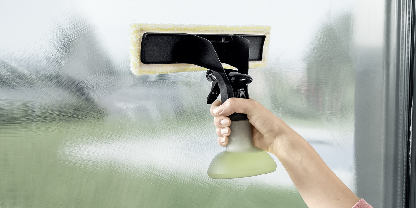 Clean glass pane with the spray bottle attachment Clean glass pane with the spray bottle attachment.