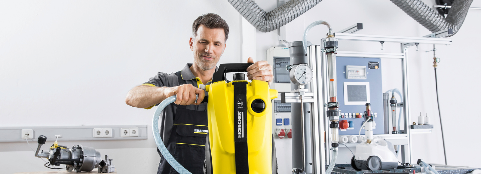 Kärcher Warranty Man repairs Kärcher High Pressure Washer