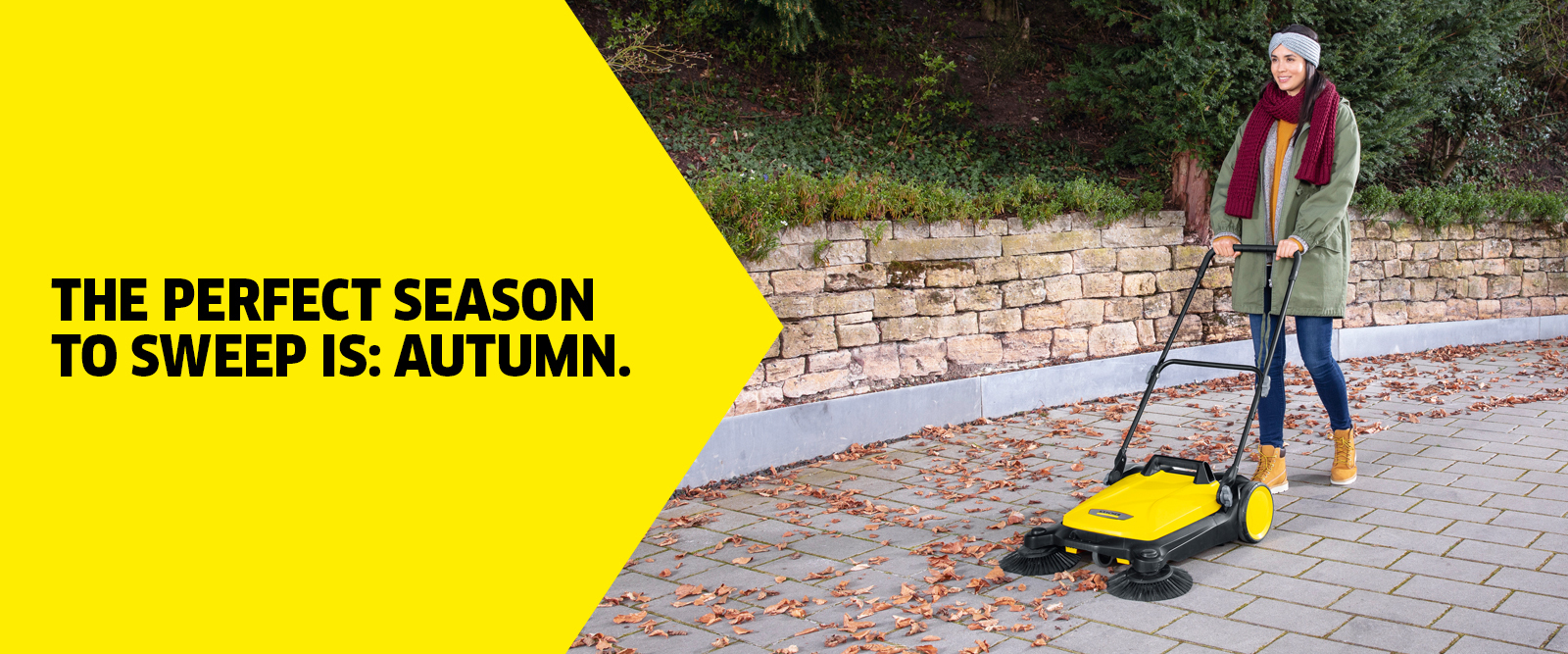 Autumn cleaning push sweeper Cleaning in autumn with a push sweeper