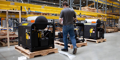 worker walks by two Landa PGHWs in a warehouse