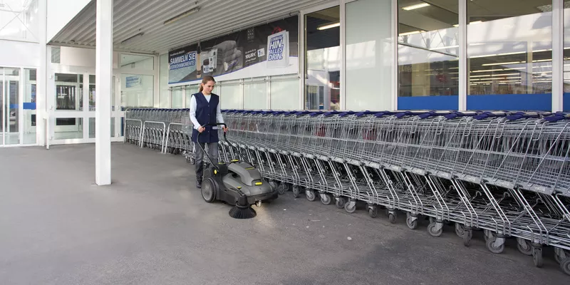 Cleaning trolley stations with a Kärcher vacuum sweeper