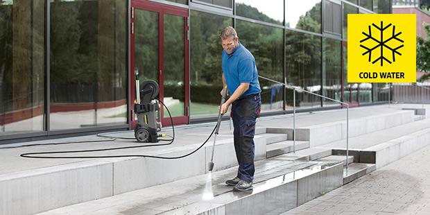 Commercial Cold Water Pressure Washers Man cleaning outdoor stairs with electric cold water pressure washer