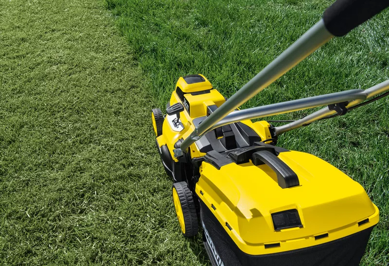 Mowing the lawn with a Kärcher lawn mower