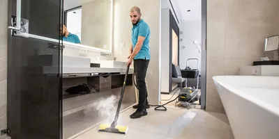 Floor disinfection in a hotel bathroom using a Kärcher steam vacuum cleaner